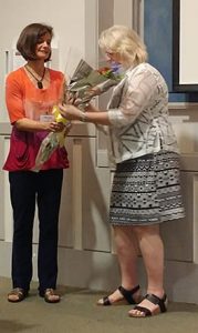 Outgoing board president present flowers to Irena Blekys at 2016 conference