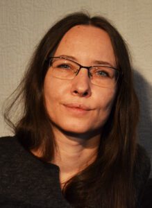 A woman with glasses and brown hair, Egle Aleknaite